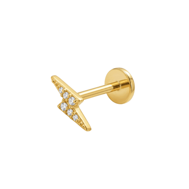 Zlatá piercing labreta s motivem blesku osázeného čirými kamínky, moderní šperk s plochou zadní stranou do conchu a lalůčku.