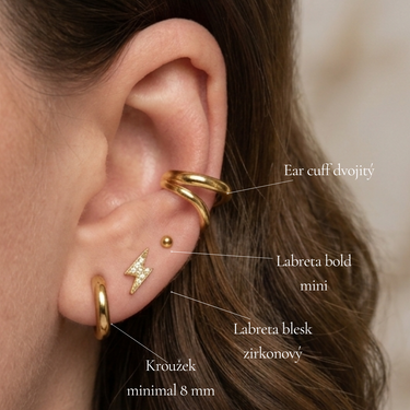  piercing labreta s motivem blesku osázeného čirými kamínky, moderní šperk s plochou zadní stranou do conchu a lalůčku.
